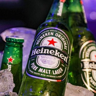 a bottle of beer on ice with a bottle of beer