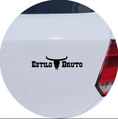 Estilo Bruto black vinyl decal with bull skull on a white car trunk.
