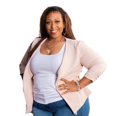 Smiling woman entrepreneur in a pink blazer and white top, posing for a professional headshot.
