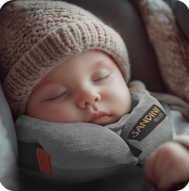 a baby sleeping in a car seat with a sleeping pillow sleepfix