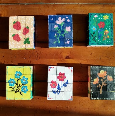 Handpainted wooden six-picture block puzzles with traditional folk art flower designs