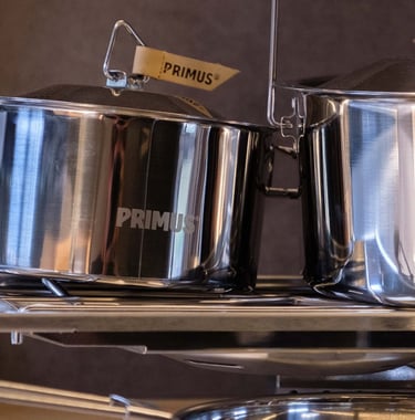Stainless steel Primus camping cookware.