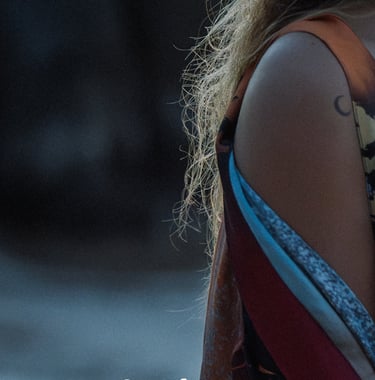 Close-up of a woman wearing a Boho Graffiti Kimono over a bikini top, with 'Coming Soon...' text ove