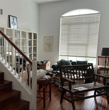 a living room with a couch and a chair