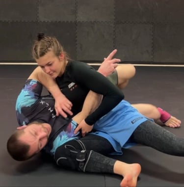 Personal Trainer teaching young Woman Self Defense