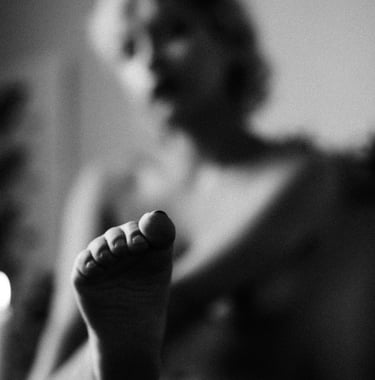 a woman's feet and toes are shown in black and white