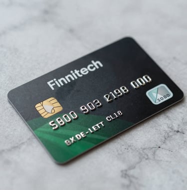 Macro shot of a sleek, black and green premium credit card resting on a marble surface. The design is minimalist and modern, reflecting the identity of a top-tier fintech brand. Elegant, sharp focus, high-end commercial photography.