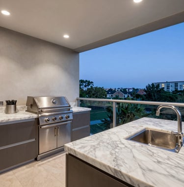 A professional real estate photograph of a gourmet balcony in a high-standard apartment in Alphaville. The space includes a modern grill area, marble countertops, and a view of a green urban landscape at twilight. Sophisticated and exclusive atmosphere.