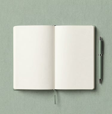 A minimalist, aesthetic flat-lay featuring a journal and a pen on a soft green linen surface #8DAF9E. The composition has plenty of white space #F7FCFA and a sense of inviting stillness. Suitable for reflecting on wisdom.