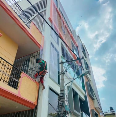 a man installing apartment duct nets in bengaluru