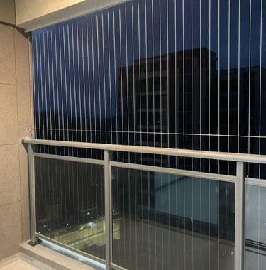 a balcony with a balcony with a view of the city with invisible grills in bengaluru