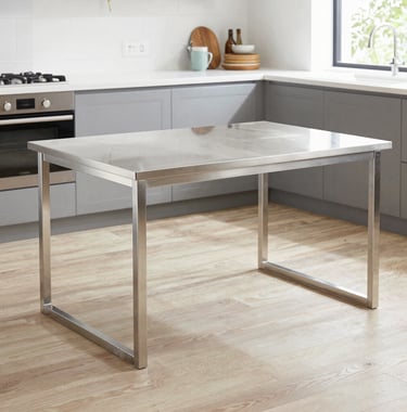Bespoke stainless steel dining table in a contemporary South American apartment. Elegant, thin profile, graphite surroundings, minimalist luxury.
