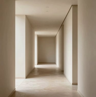 A minimalist corridor in a luxury hotel featuring soft shadows, clean architectural lines, and neutral cream and beige tones. International / High-end hospitality design.