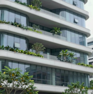Modern architectural detail of a sustainable building in Singapore, showing clean glass lines and lush greenery. The image uses a palette of #658BA3 and #F8F6F1, conveying grounded authority and sophisticated regional structure.