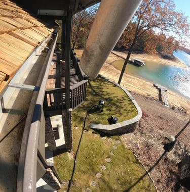 Clean gutters at Smith Lake house