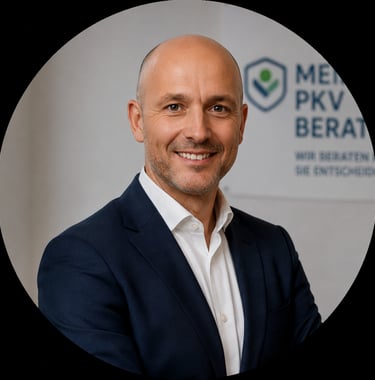 Professional portrait of a male private health insurance advisor in a navy suit and white shirt.