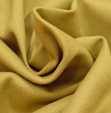 a close up of a tan colored fabric with a brown and white background