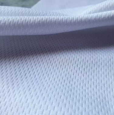 a white shirt with a black and white background