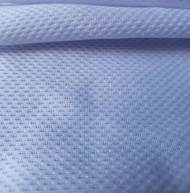a close up of a white shirt with a blue background