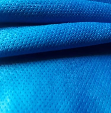 a close up of a blue fabric covered fabric