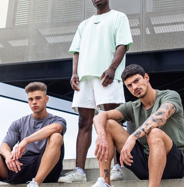 a group of men sitting on stairs with their feet on the steps
