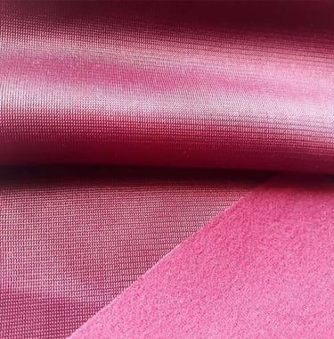 a close up of a pink fabric with a pink background