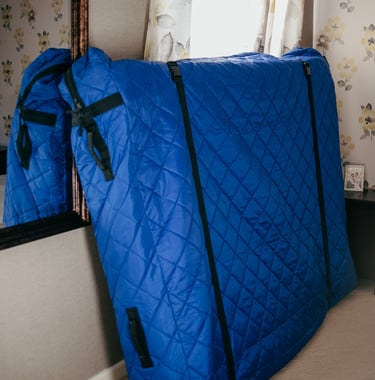 mattres protected by blue covering in worcester home