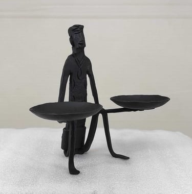 "Handcrafted tribal iron sculpture-man with oil lamps-right side-for global markets"