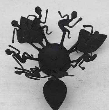 "Handcrafted tribal iron oil lamp with dancing figures–top view–for overseas demand"