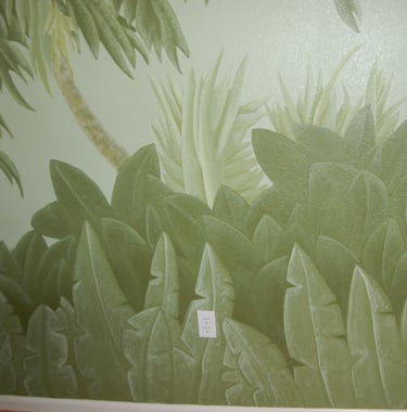 Interior mural of Florida pineflats foliage of native fern and palm trees.