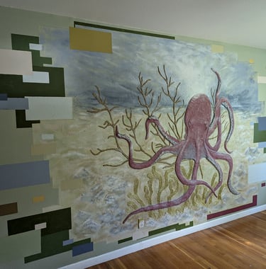 3D relief mural of an octopus in a coral bed. Green, blue seafoam green, tan, brown, yellow, cream, burgundy red colors. 