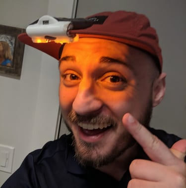 Nathan pointing to a light on his head