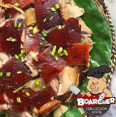 lechon on a banana leaf plate