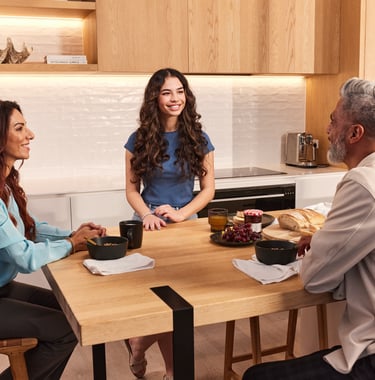 Product photography - a man and woman sitting at a table with bread