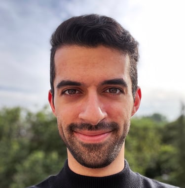a man with a beard and a black sweater