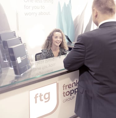 a man and woman standing in front of a reception