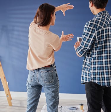 man and woman measuring something