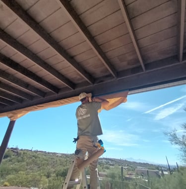 Best Handyman Tucson - Professional installer on a ladder
