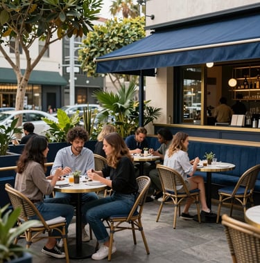 An inviting outdoor cafe patio in West Hollywood, featuring blue and gold accents, diverse patrons enjoying the creative atmosphere, and lush urban greenery, captured in a high-end lifestyle photography style, North American.