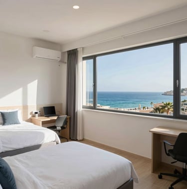 A wide shot of a modern, safe student residence room in St Paul's Bay, Malta, with large windows overlooking the Mediterranean coast, captured in a clean, bright, and professional North American / US corporate style.