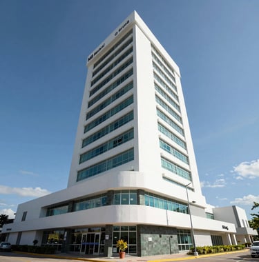 Exterior shot of the MB Medical Tower in Mérida, Yucatán. A state-of-the-art medical facility with a clean, white and dark slate green facade. Bright daylight, wide-angle lens, professional architecture photography.