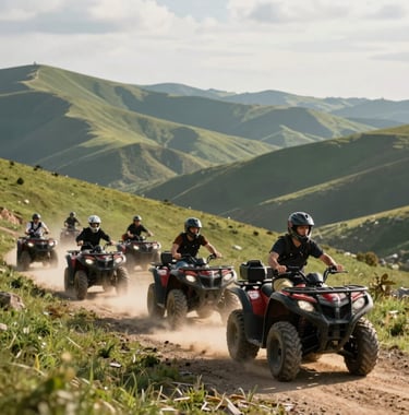 Action shot of a group of people on quad bikes navigating a scenic mountain path, green hills stretching into the distance under a warm afternoon sun.