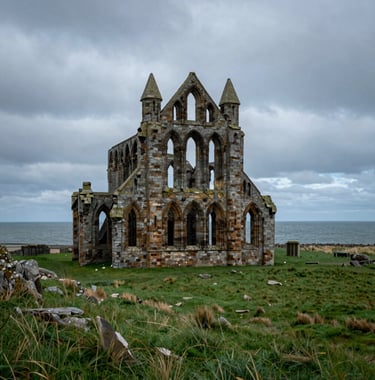 A high-quality photograph of the dramatic ruins of Whitby Abbey standing on a cliffside. The North Sea is visible in the background under a moody, overcast sky. The palette features deep forest sage and dark slate green tones, Northern European / British / Yorkshire.