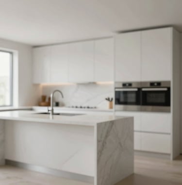 Interior view of a designer kitchen with a marble island and high-end built-in appliances. The lighting is bright and natural. Clean lines and a minimalist aesthetic that reflects a premium property management standard.