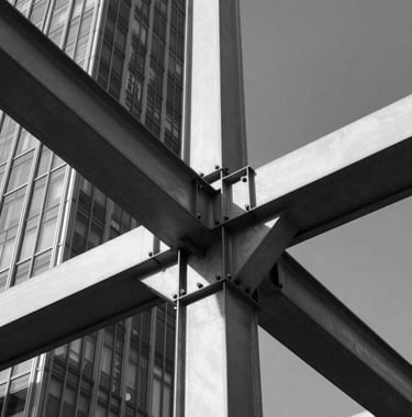 A close-up photography of a structural steel beam and glass joint of a modern skyscraper. The image is monochrome, focusing on the precision of the engineering and the clarity of the lines against a dark sky.