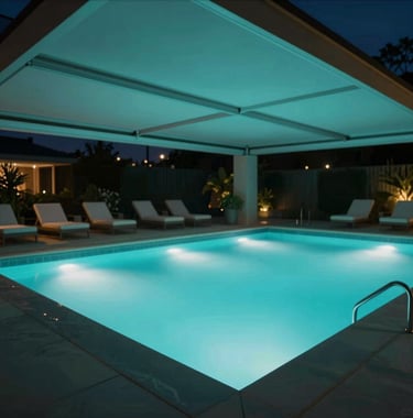An automated outdoor pool area at night. Motorized shading is half-retracted, and the pool glows with teal-cyan (#2E7D8A) smart lights. The vibe is ultra-premium and serene.