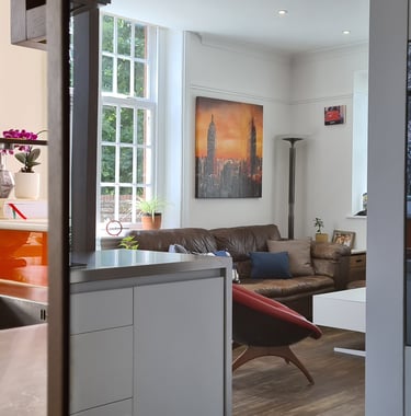 Modern open-plan kitchen architecture in Bury St Edmunds showing ergonomic layout and cooking zones.