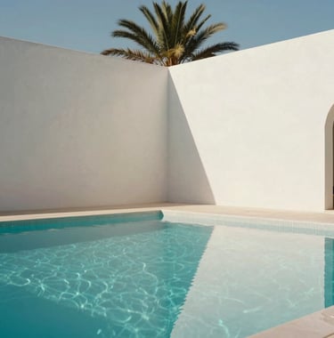A minimalist architectural shot of a turquoise infinity pool at a luxury Marrakech villa. The walls are smooth soft off-white plaster, reflecting the bright North African / Moroccan sun. A single palm tree casts a long shadow.