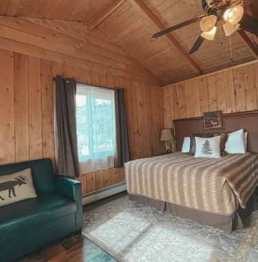 room 1 interior with bed and twin sofa bed