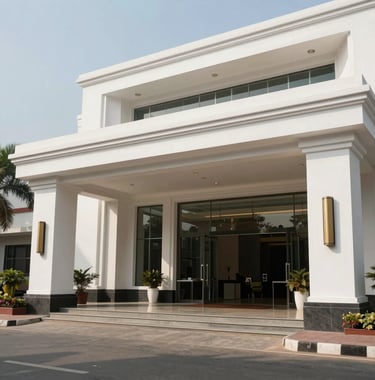 Wide shot of a prestigious corporate entrance in Vadodara, India, featuring clean white architectural lines and elite professional ambiance, daytime photography.